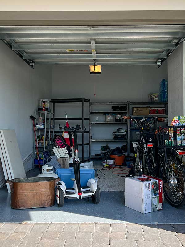 cluttered garage needing to be organized-vert